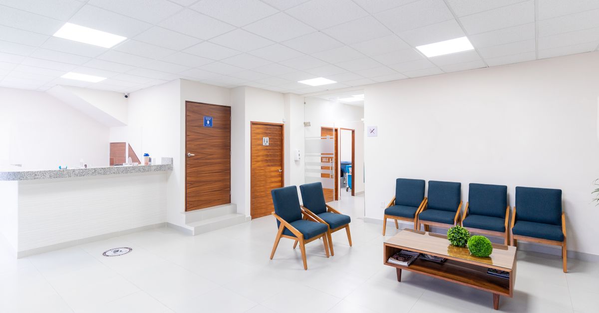 Empty clinic waiting area with seats, where bleeding after an embryo transfer is assessed